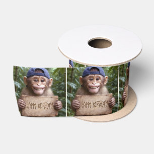 Schimpanse mit Happy Birthday-Schild Satinband