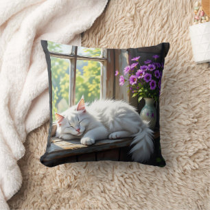 Schlafende weiße Katze und violette Blumen Kissen