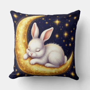 Schlafender weißer Hase auf goldenem Halbmond Kissen