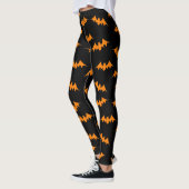 Schlägerconfetti-Gamaschen orange/Schwarzes Leggings (Links)