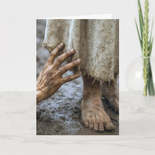 Schlammige Hand greift nach Jesus Karte