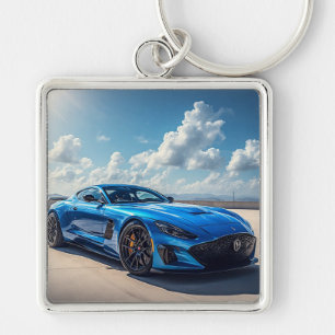 Schlankes blaues Sportauto unter einem lebendigen  Schlüsselanhänger