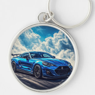 Schlankes blaues Sportauto unter einem lebendigen  Schlüsselanhänger