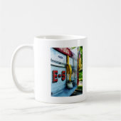Schlauch in Eimer auf Feuerzug Kaffeetasse (Links)