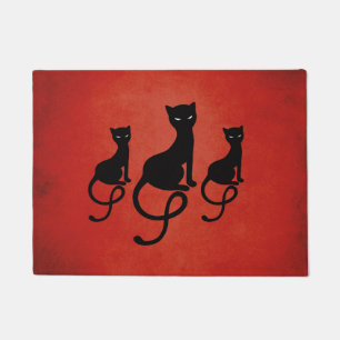 Schlechte liebenswürdige schwarze Katzen des Fußmatte