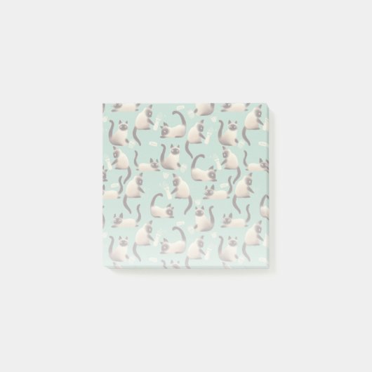 Schlechte siamesische Katzen klopfen über Post-it Klebezettel (Vorderseite)