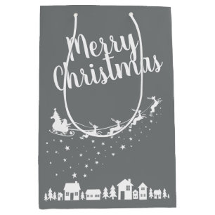 Schlitten und Rentiere des Weihnachtsmanns über de Mittlere Geschenktüte