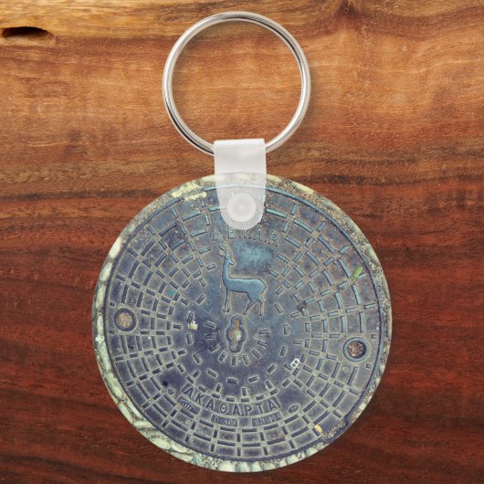 Schlüsselanhänger mit Manhole-Abdeckung und Kopfst (Vorderseite)