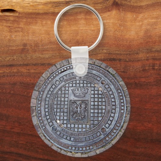 Schlüsselanhänger mit Manhole-Abdeckung und Kopfst (Vorderseite)