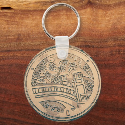 Schlüsselanhänger mit Manhole-Abdeckung und Kopfst (Vorderseite)