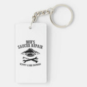 Schlüsselanhänger mit Saucer-Repair-Logo des schwa (Rückseite)