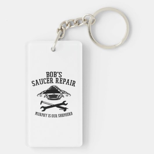 Schlüsselanhänger mit Saucer-Repair-Logo des schwa (Rückseite)