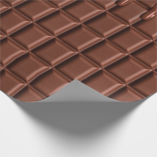 Schmelzschokolade, die über einen Schokoladenblock Geschenkpapier (Ecke)