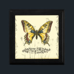 Schmetterling mit Wildblumen Geschenkbox<br><div class="desc">Dieses Stück von Jennifer Goldberger ist Gegenstand eines bunten,  dekorativen Schmetterlings. Wildblumen werden an den Seiten und unter dem riesigen Schmetterling gezeichnet. Eine schöne pastellfarbene Grenze rundet die Szene ab. Bestellen Sie noch heute Ihren Ausdruck!</div>