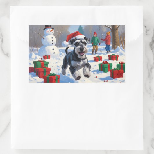 Schnauzer läuft im Schnee mit Weihnachtshut Rechteckiger Aufkleber (Tasche)