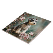 Schnauzer-Welpe unter Frühlings-Kirschblüten Fliese (Seite)