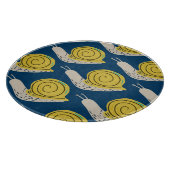 Schnecken Silhouetten: gelb, rosa Muster. Schneidebrett (Ecke)