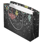 Schnee blättert auf Weihnachtsverzierungen der Große Geschenktüte (Rückseite Schrägansicht)