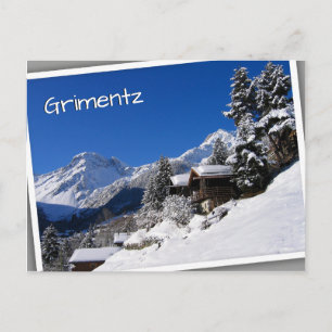 Schneebedeckte Blockhütten in der Schweiz Postkarte
