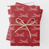 Schneeflocke Flugzeug auf rot. Umhüllungspapierblä Geschenkpapier Set (Beispiel)