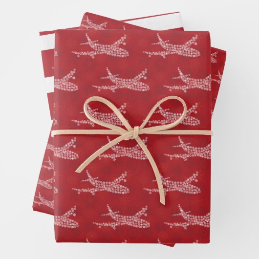 Schneeflocke Flugzeug auf rot. Umhüllungspapierblä Geschenkpapier Set (Beispiel)