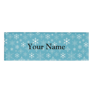 Schneeflocken auf blauem Hintergrund Namenschild