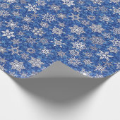 Schneeflocken auf saphienblauem Schneesturm-Hinter Geschenkpapier (Ecke)