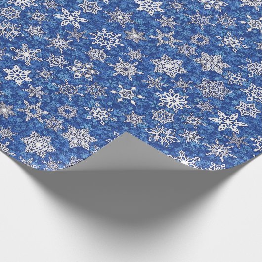 Schneeflocken auf saphienblauem Schneesturm-Hinter Geschenkpapier (Ecke)