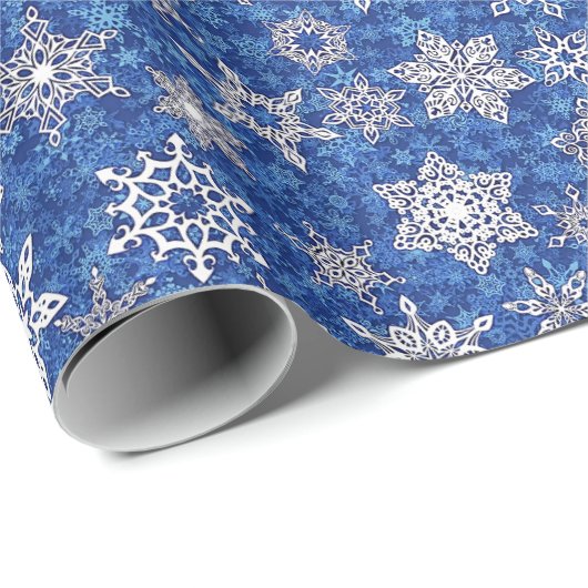 Schneeflocken auf saphienblauem Schneesturm-Hinter Geschenkpapier (Rolleneckpunkt)