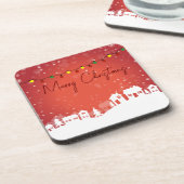 Schneeflocken bedeckten die Weihnachtshäuser Getränkeuntersetzer (Linke Seite)