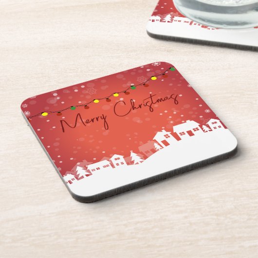 Schneeflocken bedeckten die Weihnachtshäuser Getränkeuntersetzer (Linke Seite)