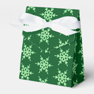 Schneeflocken, hellgrüne Kristalle auf dunkelgrün Geschenkschachtel
