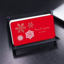 Schneeflocken in Gold und Weiß gegen Rot Visitenkarte