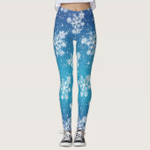 Schneeflocken und Sterne auf blass blauer Erde Leggings (Vorderseite)