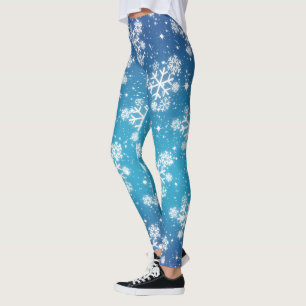 Schneeflocken und Sterne auf blass blauer Erde Leggings