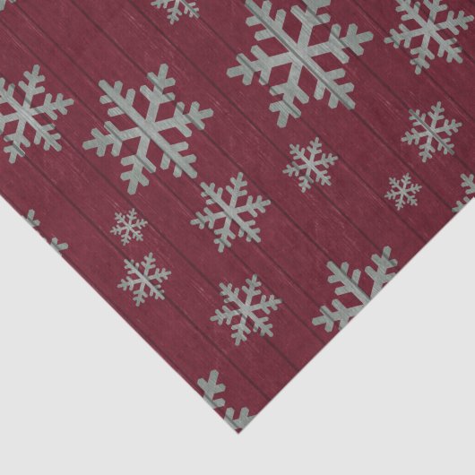 Schneeflocken versilbern auf rustikalem Rot Seidenpapier (Ausschnitt)