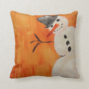 Schneemann auf Orange Kissen