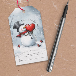 Schneemann bietet Liebe mit einem großen Herz-Gesc Geschenkanhänger