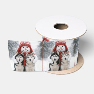Schneemann umarmt sibirische Huskys Satinband
