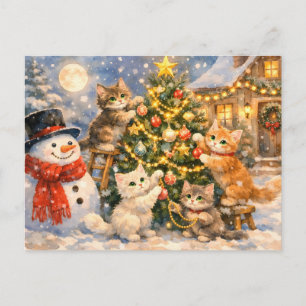 Schneemann und Kätzchen schmücken den Weihnachtsba Feiertagspostkarte