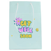 Schnell und gut kühn mit Blume auf blau Mittlere Geschenktüte (Vorderseite)