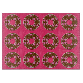 Schokolade Donuts auf heißen rosa Schnittpappe Schneidebrett