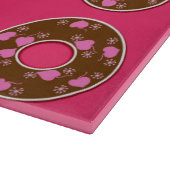 Schokolade Donuts auf heißen rosa Schnittpappe Schneidebrett (Ecke)