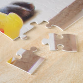 Schokolade-Labrador-Welpe mit Spielzeugente Puzzle (Seite)