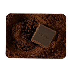Schokoladen-Quadrat im Schokoladen-Pulver Magnet