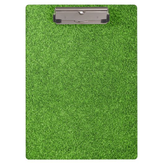 Schöne Beschaffenheit des grünen Grases vom Klemmbrett (Vorderseite)