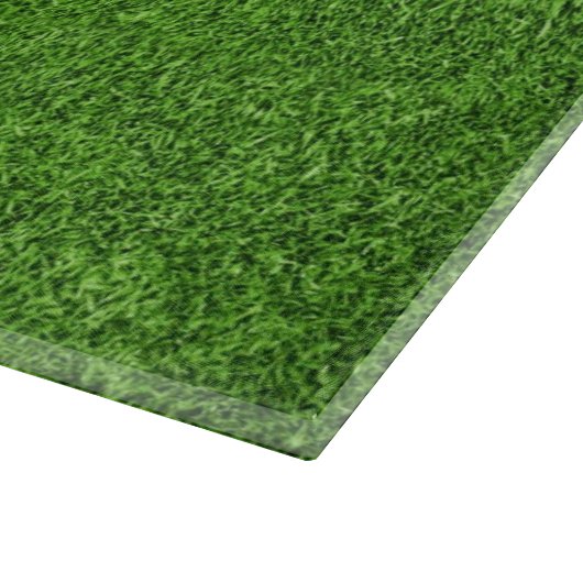 Schöne Beschaffenheit des grünen Grases vom Schneidebrett (Ecke)