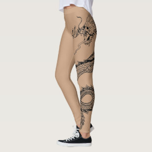 Schöne Drachenattoo im Hintergrund der Hautfarbe Leggings