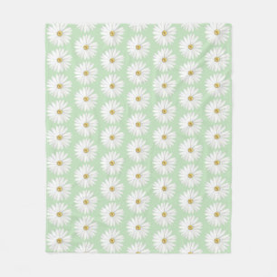Schöne Gänseblümchenblume auf Hellgrün Fleecedecke