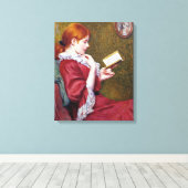 Schöne junge Frau mit rotem Haar, die ein Buch lie Leinwanddruck (Insitu (Holzboden))